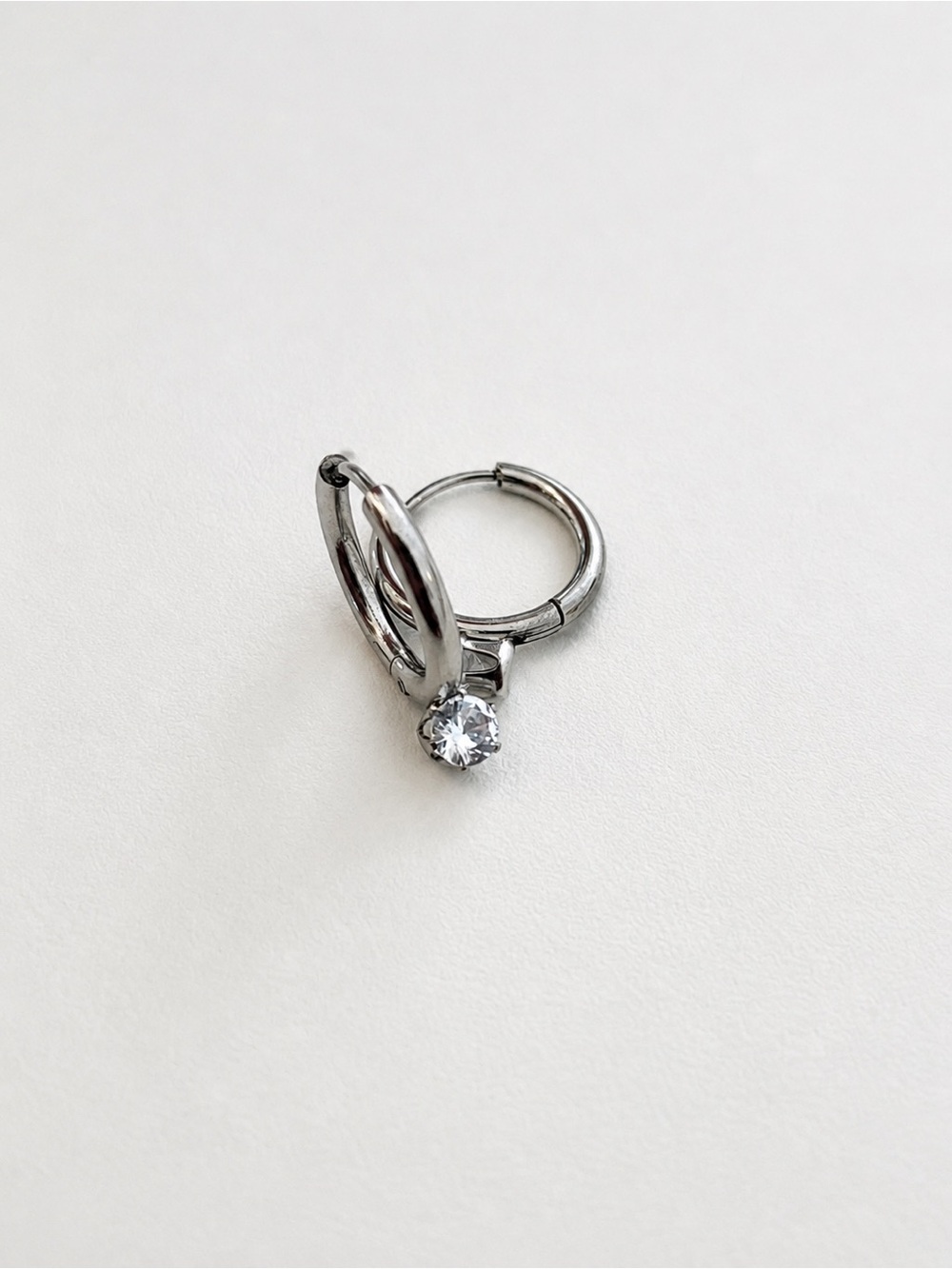 Silver Tone Huggie Hoop Earrings with Clear Accent | Stainless Steel